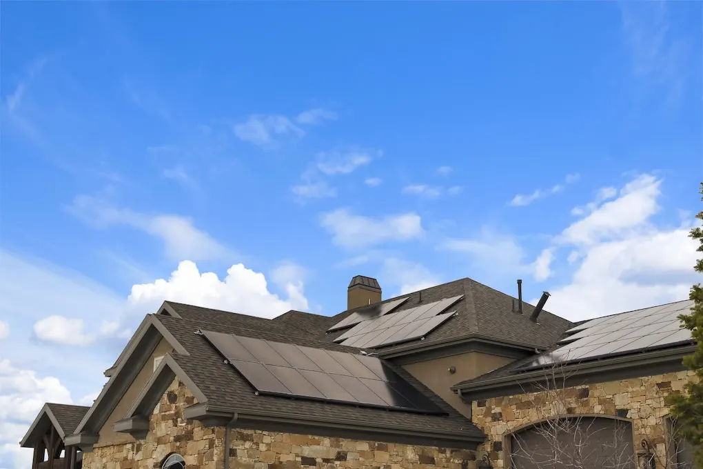 house roof with dark color solar panels