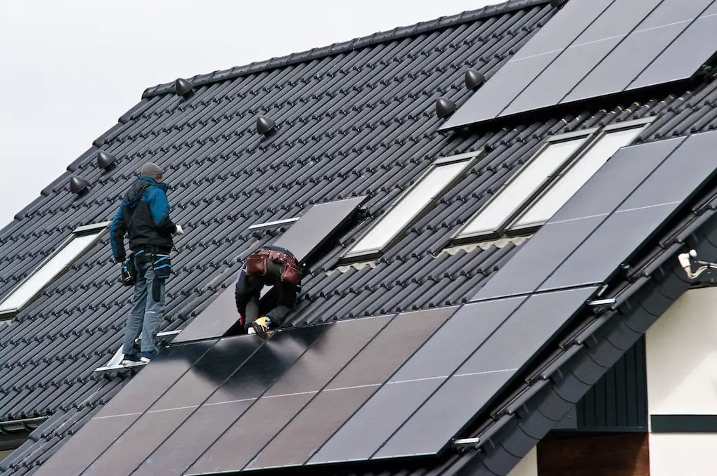 crew installing solar panels