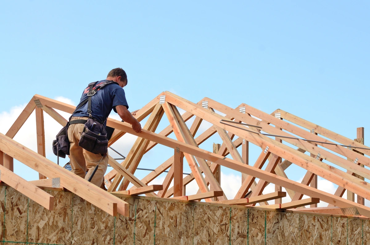 man-on-roof-trusses