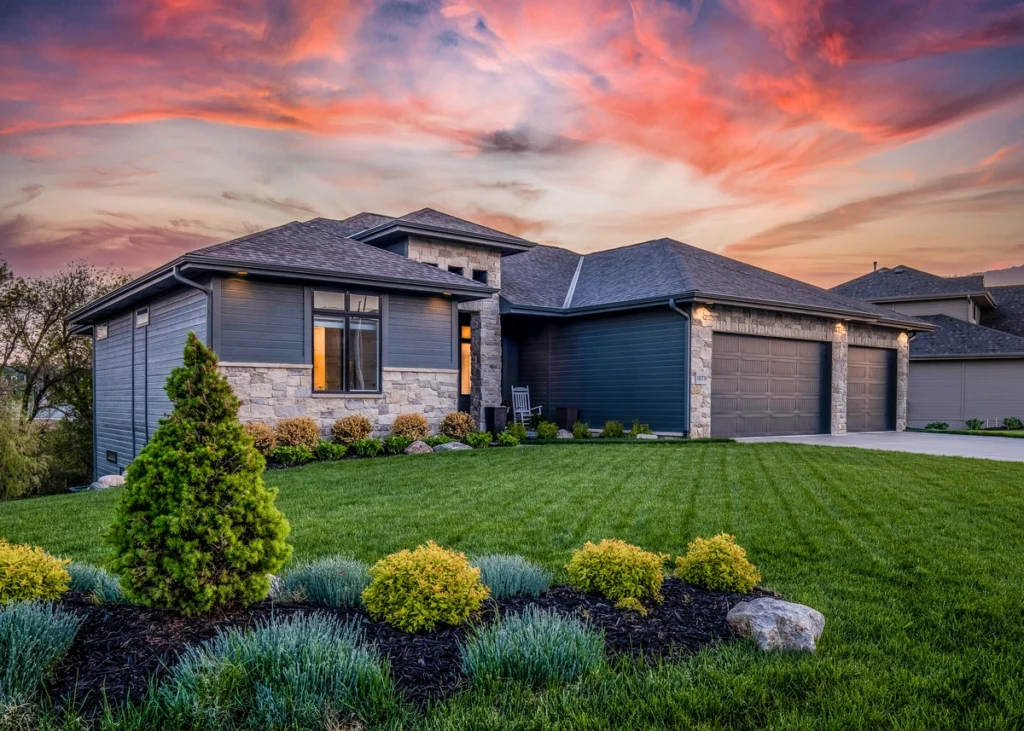 hip style roof with a colorful sunset