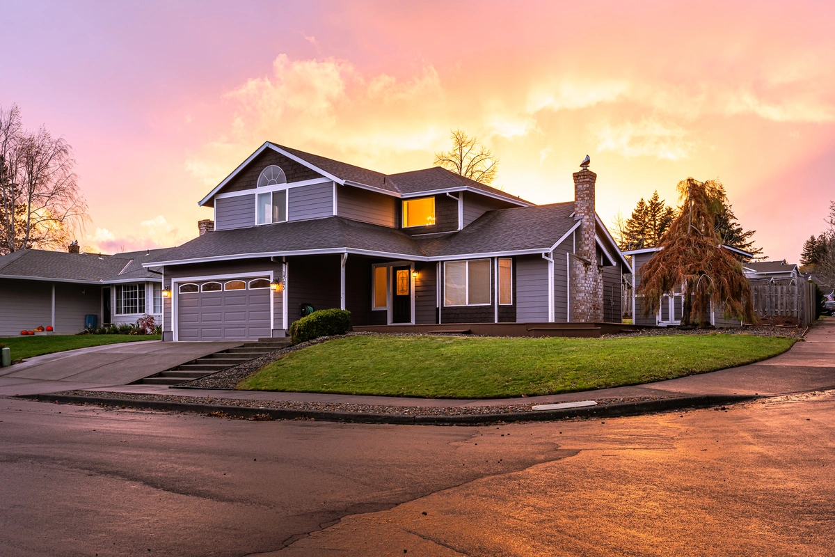 roof warranty-well maintained home against a sunset sky