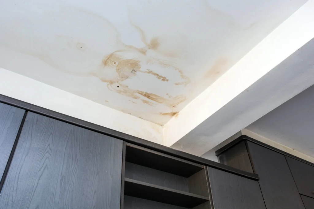 water leaking from ceiling-stained ceiling from water damage