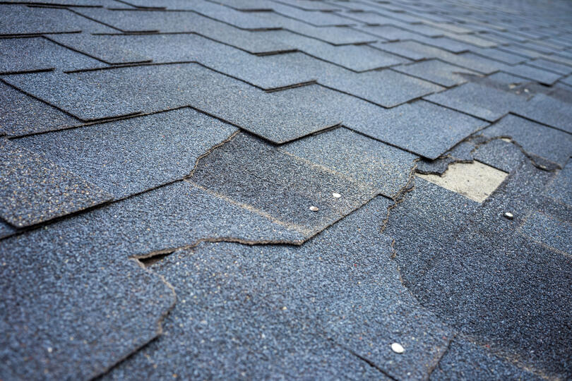 missing shingles-cracked, broken, and missing shingles on roof