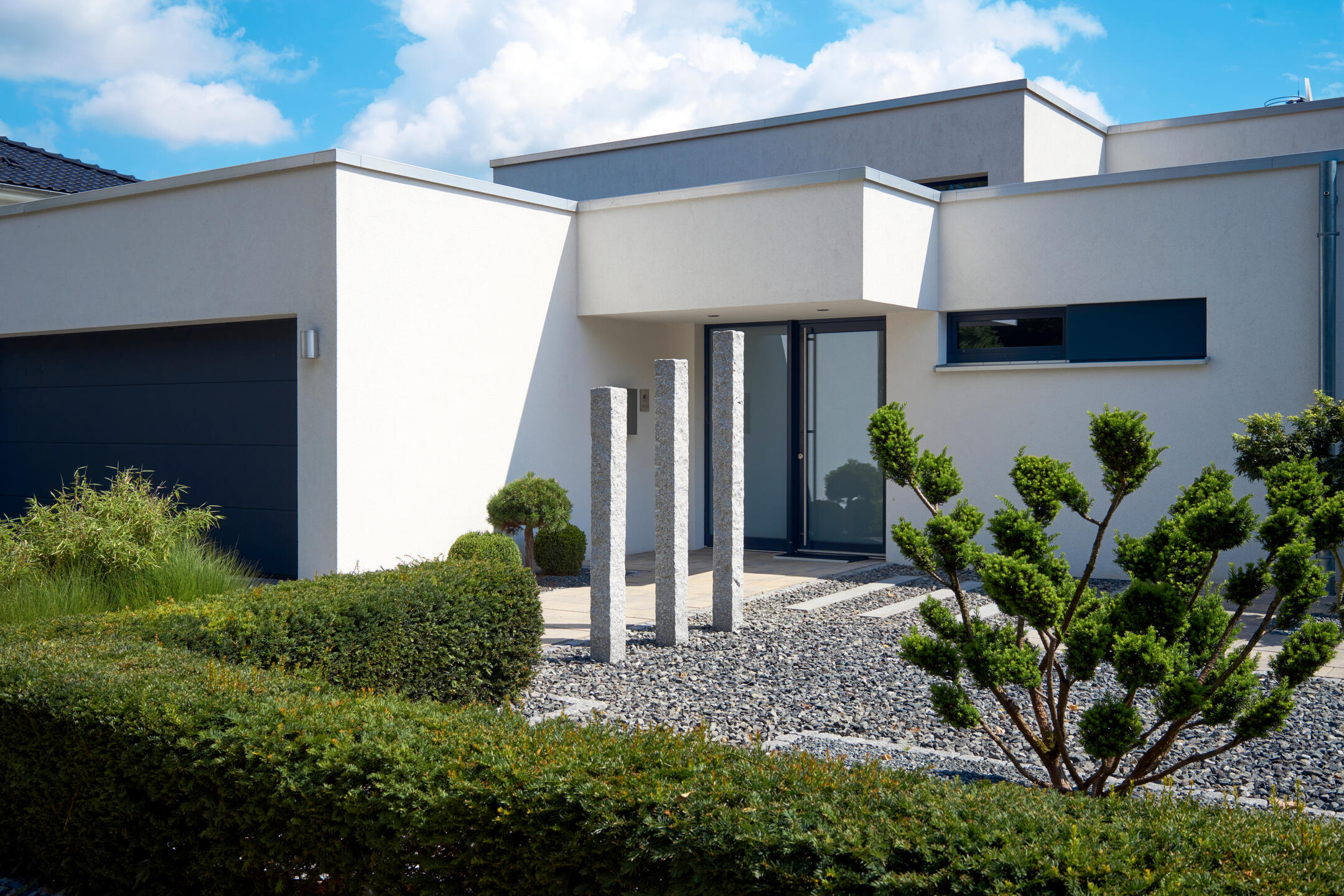 single ply membrane roof-white residential home with a flat roof with modern architecture