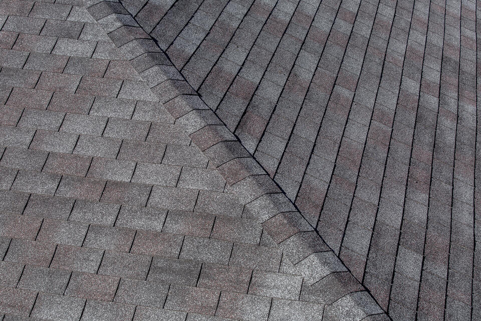 best roof shingles-close up of gray 3 tab shingles on a roof