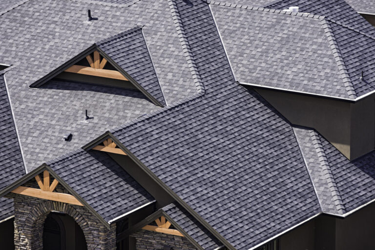 best roof shingles-distant view of dark gray shingles on a house roof