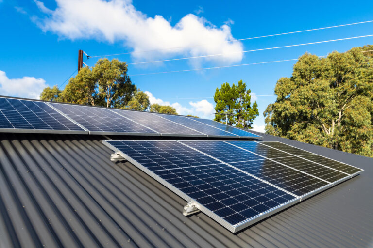 solar panels on metal roof-black metal roof with large solar panels installed on the surface